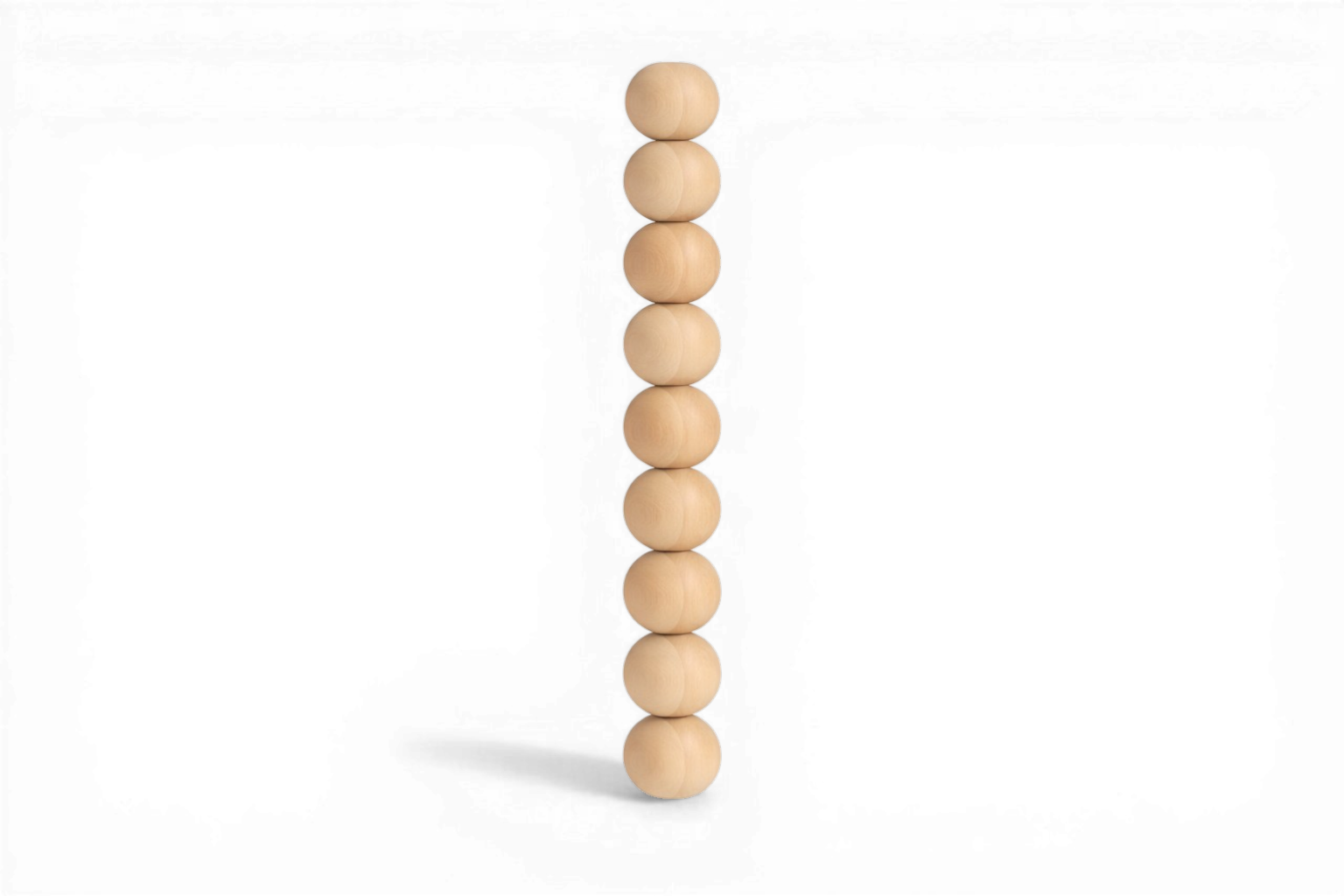 Stack of wooden beads on a white background