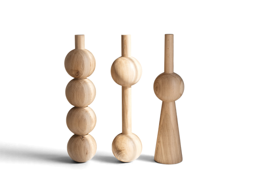 Three natural wood decorative objects with rounded geometric shapes, displayed on a clean white background.